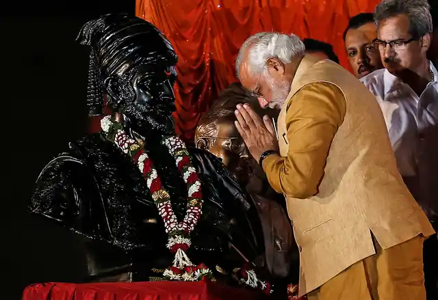 Prime Minister Narendra Modi salutes the statue of Chhatrapati Shivaji during an election campaign rally in Mumbai in 2014. When he was the CM of Gujarat, he announced building a 189 m tall statue of Sardar Patel at the cost of over Rs 2,000 crore. (Picture: Reuters)