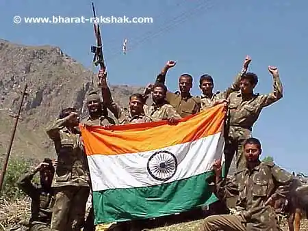 Point 4825Back in Indian hands: Jawans with the flag on Point 4825, which was being held by the enemy in the Mushkoh Valley.