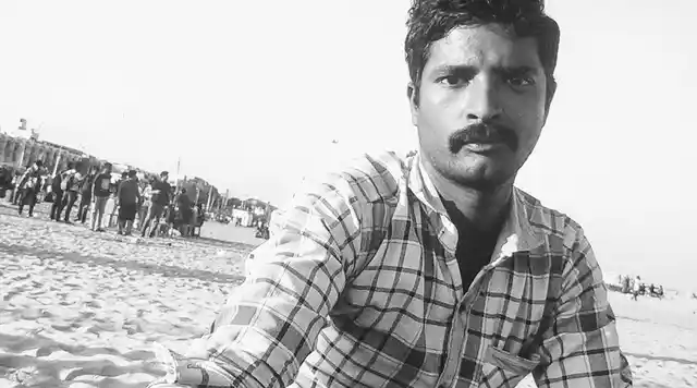 Seenu, a tea seller at the Chennai Marina Beach, wonders when the hullabaloo will end. (Photo: Vikram Venkateswaran)
