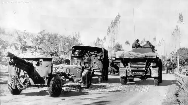 Armour and guns on the Baramulla Road, on 17 November in the year 1947. A mechanised column of Damlier Armoured Cars and 25 Pounder Guns of the Indian Army moves along the road to Baramulla.