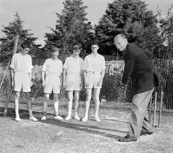 Cariappa tries his hand at cricket with Australian boys. 