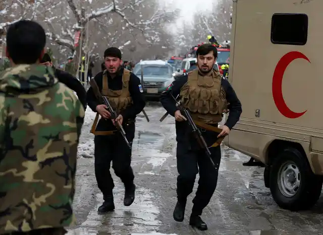 Afghan policemen arrive at the site of a bomb blast in Kabul. (Photo: Reuters)
