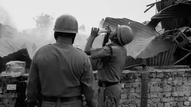 A fireman takes a sip of water while fighting fire. (Photo courtesy: Sameer Khan) 