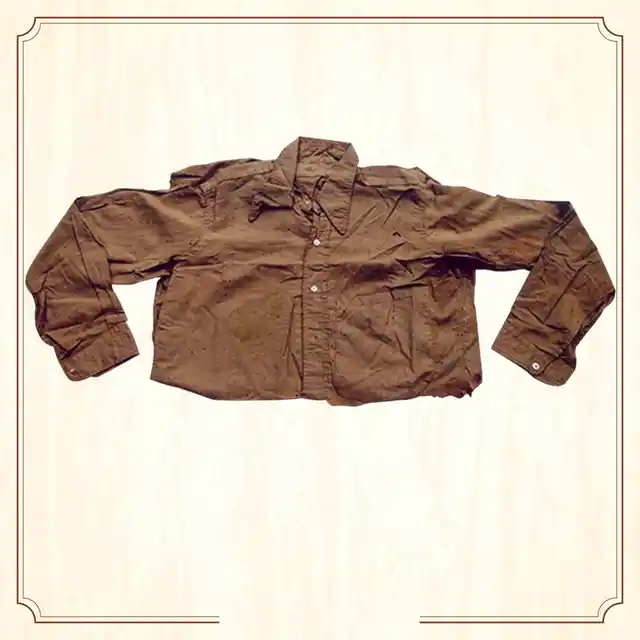 <a href="http://www.supremecourtofindia.nic.in/sciphoto/photo_m1.html#"></a> Shirt of Bhagat Singh. A full sleeves khaki shirt with Italian collar, marked Bhagat Singh on the collar. (Image Altered by The Quint/Original Photo Courtesy: <a href="http://www.supremecourtofindia.nic.in/sciphoto/photo_m1.html">Supreme Court of India)</a>