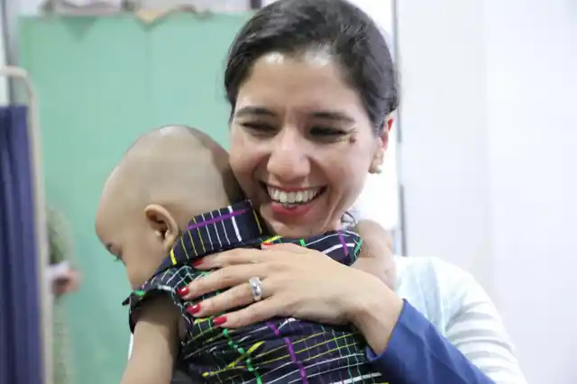 Kriti with a baby at the hospital. (Photo: <b>The Quint</b>)