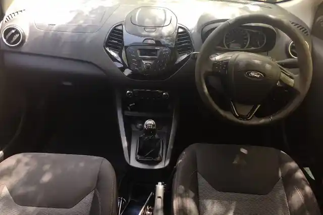 The red stitching seats are soft and comfortable, but what’s with the console on the dashboard, Ford? The Figo Sports costs more than Rs 6 lakh, surely they could have given us a better infotainment system. This also means, we do not get a parking camera or sensor on this one.