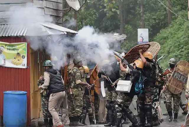 Security personnel shoot tear gas on the protesters. (Photo: PTI)