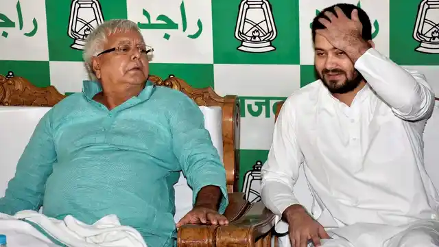 Lalu Prasad Yadav with his son Tejashwi Yadav.