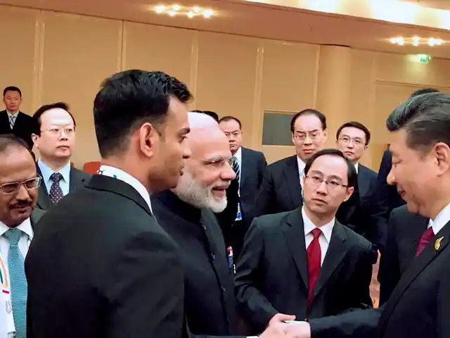Prime Minister Narendra Modi and Chinese President Xi Jinping exchange greetings at the BRICS leaders’ informal gathering hosted by the China, in Hamburg, Germany on Friday.