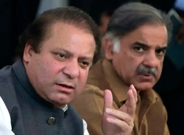 File photo of Pakistan’s deposed Prime Minister Nawaz Sharif (L) addressing a news conference with his brother Shahbaz Sharif in Lahore, Pakistan.