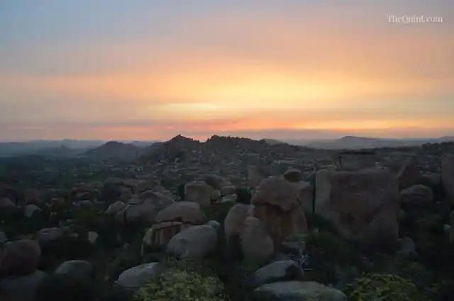 Sunrise over the boulder-strewn landscape of Hampi