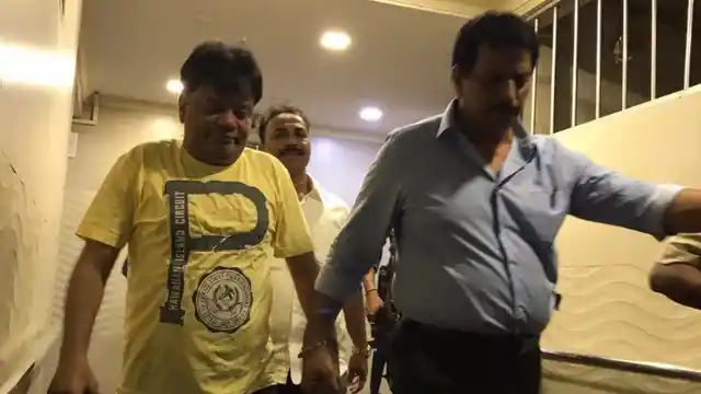 Dawood Ibrahim’s brother Iqbal Kaskar (left) being taken by the Maharashtra police.