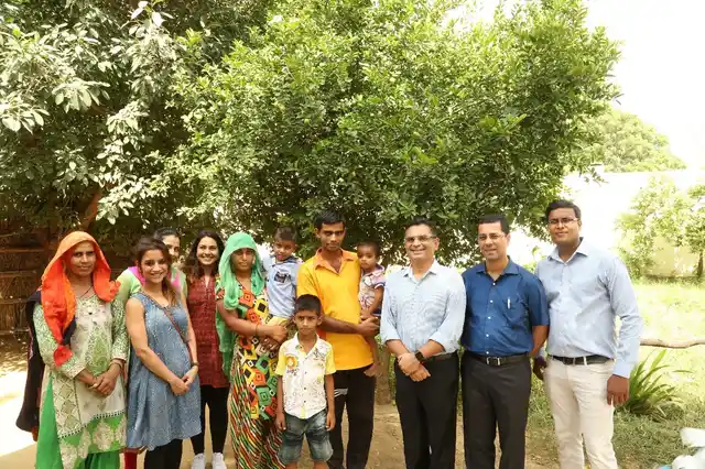 Anjali and her family with the Genesis Foundation team.