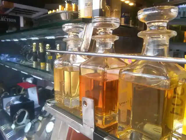 Handmade fragrances made from essential oils displayed at a handicraft store.