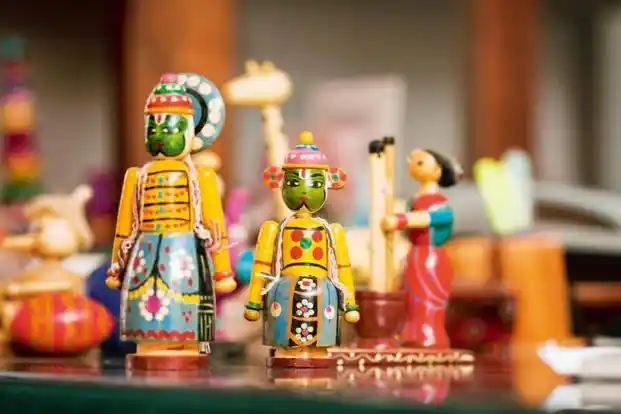 A colorful set of handmade Channapatna toys at display.