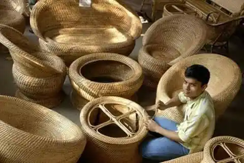 Artisans engaged in wood carving and inlay work.