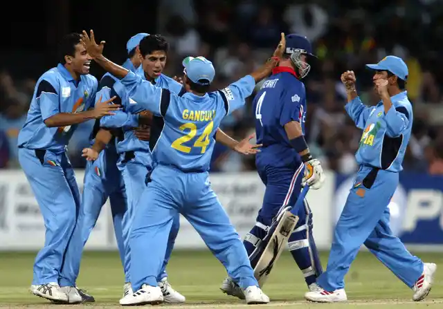 Indian cricketer Ashish Nehra (3rd from L, facing the camera) celebrates with teammates after taking the wicket of England’s Alec Stewart (2nd R) during a group A match of the 2003 World Cup.