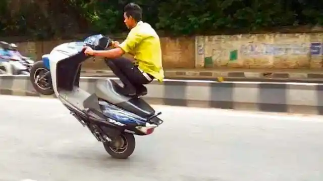 File photo of a youth performing wheelie in Bengaluru. 