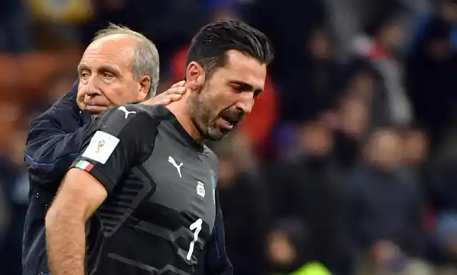 Italy coach Gian Piero Ventura, left, consoles Gianluigi Buffon at the end of the World Cup qualifying play-off return leg soccer match between Italy and Sweden, at the San Siro stadium in Milan, Italy, Monday, Nov. 13, 2017. 