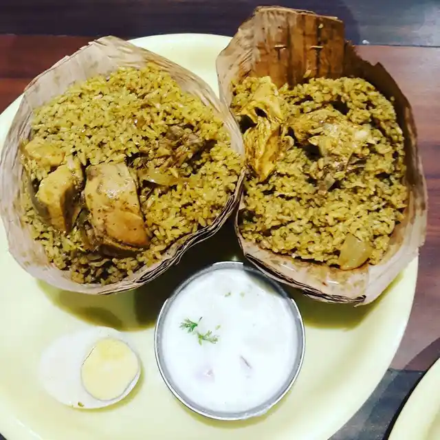 Donne Biryani served in cups made of palm leaves.