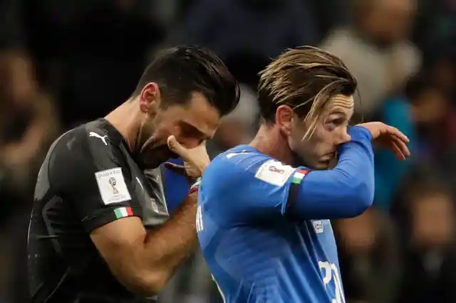 Italy’s goalkeeper Gianluigi Buffon, left, and Manolo Gabbiadini react to their team’s elimination. 