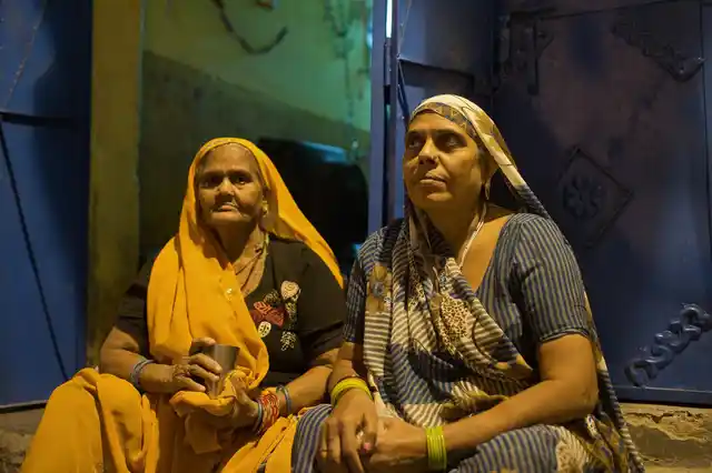 Triveni with one of her neighbors in Kabir Nagar basti, north Delhi. 