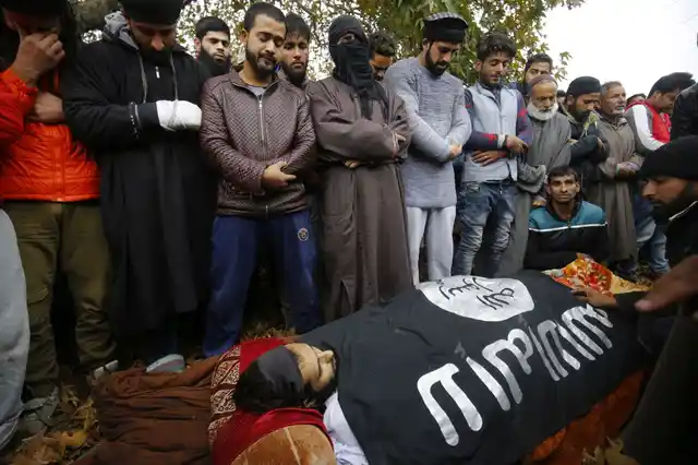 People in Srinagar performing Namaz-e-Janazah of the militant Mugees Ahmad Mir of Parimpora who was killed in an encounter. Sub-Inspector Imran Tak of Jammu and Kashmir Police was also killed in the same encounter in Zakoora on 18 November.