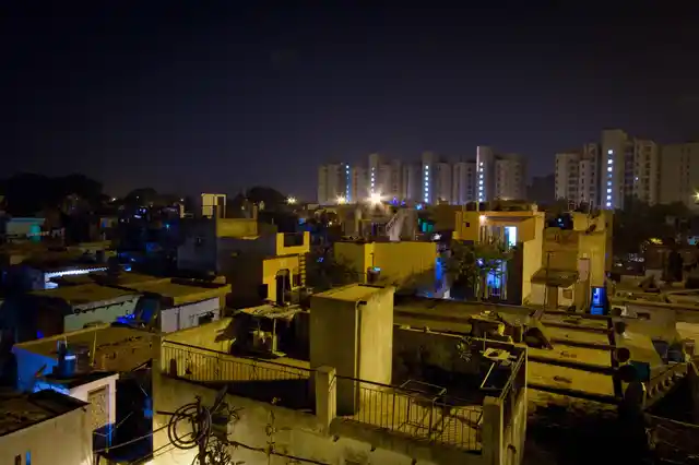 Night view of Chandrawal Basti overlooking the Parsvnath High Towers, North Delhi. 