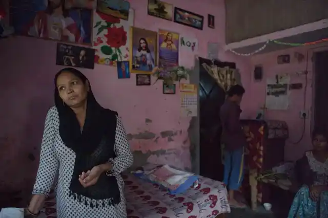 Neelam with her children in their one room quarter allotted in Sector 5, Sarkari Nigam Sewa, Ghaziabad. 
