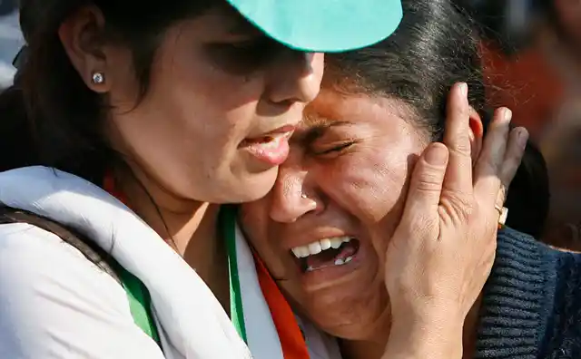 A woman mourns the loss of her relative to the attack