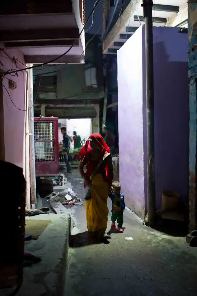 A woman with her kid in the narrow lanes of Kabir Nagar basti, north Delhi. 