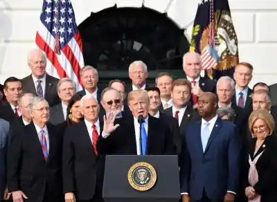 WASHINGTON, Dec. 20, 2017 (Xinhua) -- U.S. President Donald Trump speaks at an event celebrating the passage of the tax bill on the South Lawn of the White House in Washington D.C., the United States, on Dec. 20, 2017. The U.S. Congress on Wednesday finally passed the Republican bill to overhaul the U.S. tax code over three decades, sending it to President Donald Trump