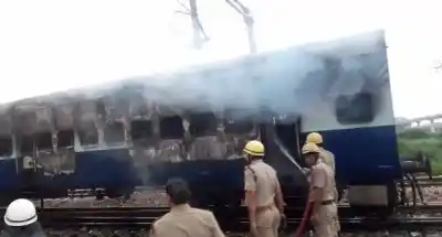 Delhi: Firefighters douse fire after two bogies of a train standing in a yard of Anand Vihar Railway Station in east Delhi caught fire on Aug 25, 2017. (Photo: IANS)
