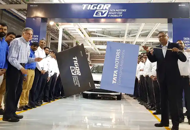 Ratan N Tata, Chairman Emeritus, Tata Group and N Chandrasekaran, Chairman, Tata Sons and Tata Motors flagging off the first batch of Tigor EVs from the Sanand plant.