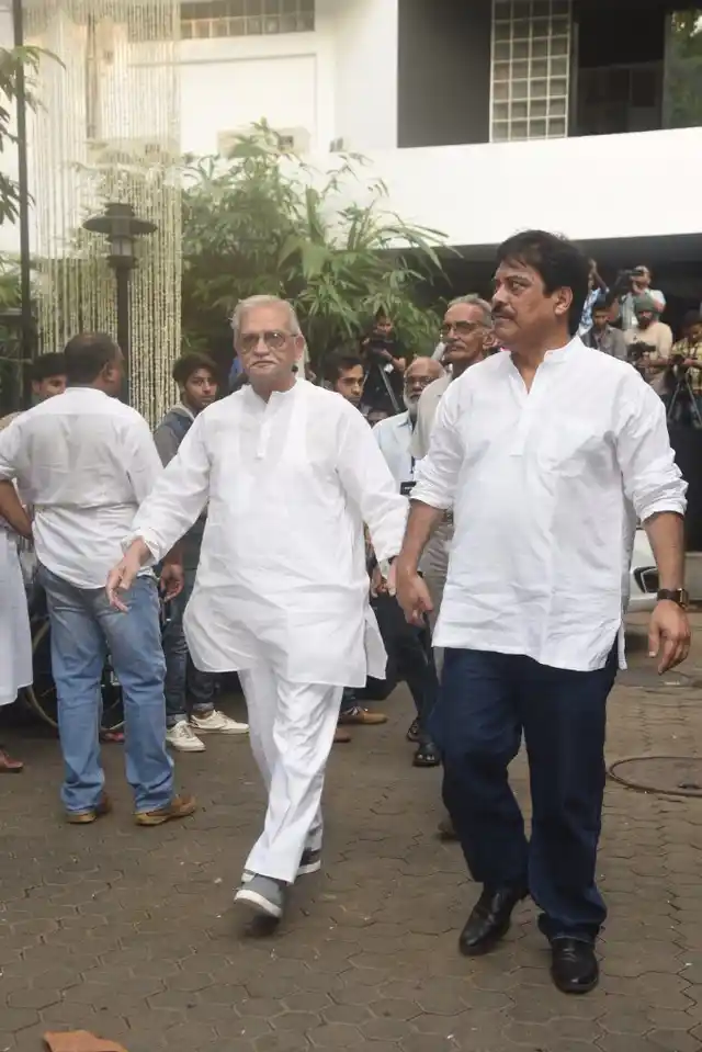 Gulzar arrives for the service. 