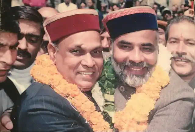 An old photo of BJP CM candidate Prem Kumar Dhumal with Prime Minister Narendra Modi.