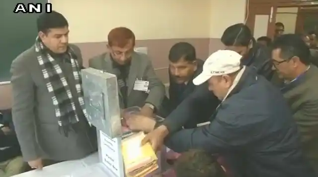 Postal ballots de-sealed by officials at a counting centre in Shimla’s Sanjauli, as counting of votes begins.