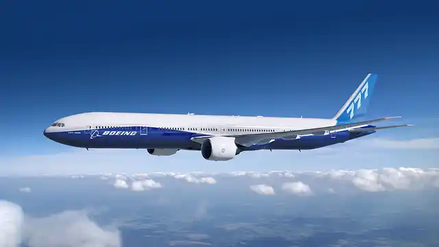 The Boeing 777-300ER has a range of 13,650 Km. 