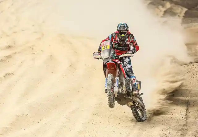 Honda rider pops his wheel.