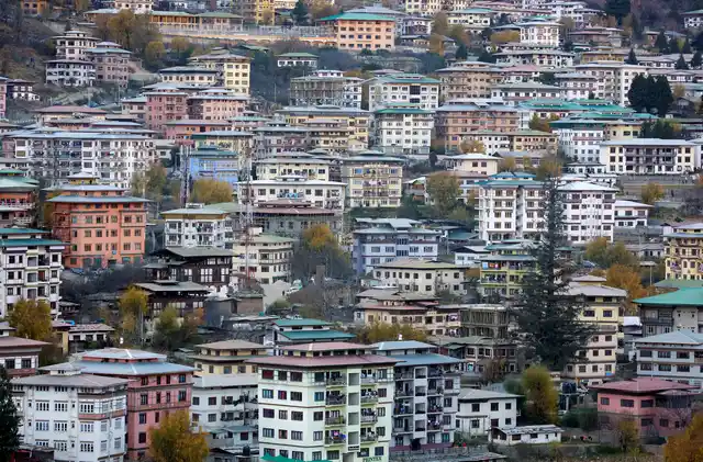 Houses stand in the capital city of Thimphu, Bhutan, 11 December 2017. 