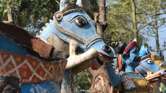 Chariot horses reined in by the soldier/God.