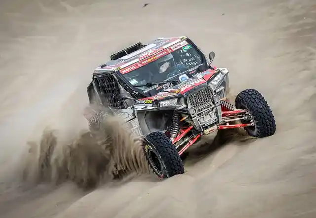 Kicking up sand.