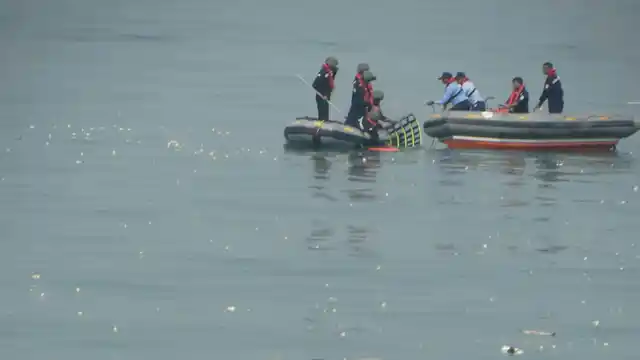 The Chopper’s debris being pulled out of water.