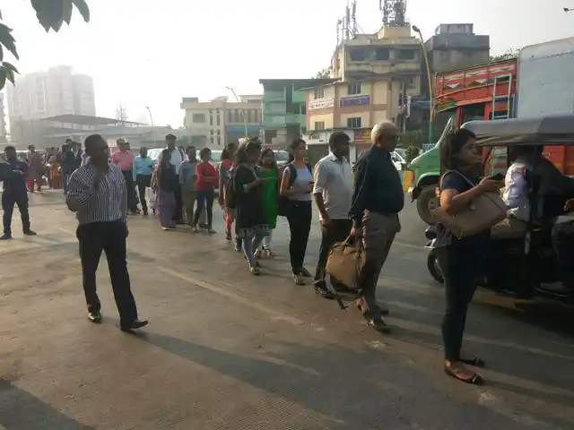 People seen waiting near Thane’s Vartak Nagar because of a lack of autorickshaws and other transport in the state.