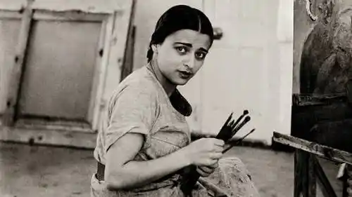 Amrita Sher-Gil in front of her canvas.
