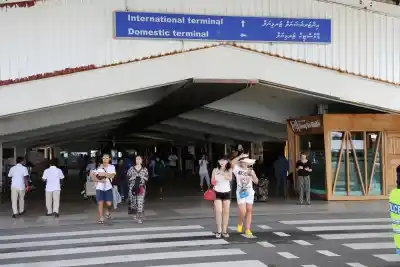 MALE, Feb. 7, 2018 (Xinhua) -- Tourists walk out of the airport in Male, Maldives, Feb. 7, 2018. Maldivian President Abdulla Yameen on Monday evening declared a state of emergency amid political crisis in the country. (Xinhua/Zhu Ruiqing/IANS)