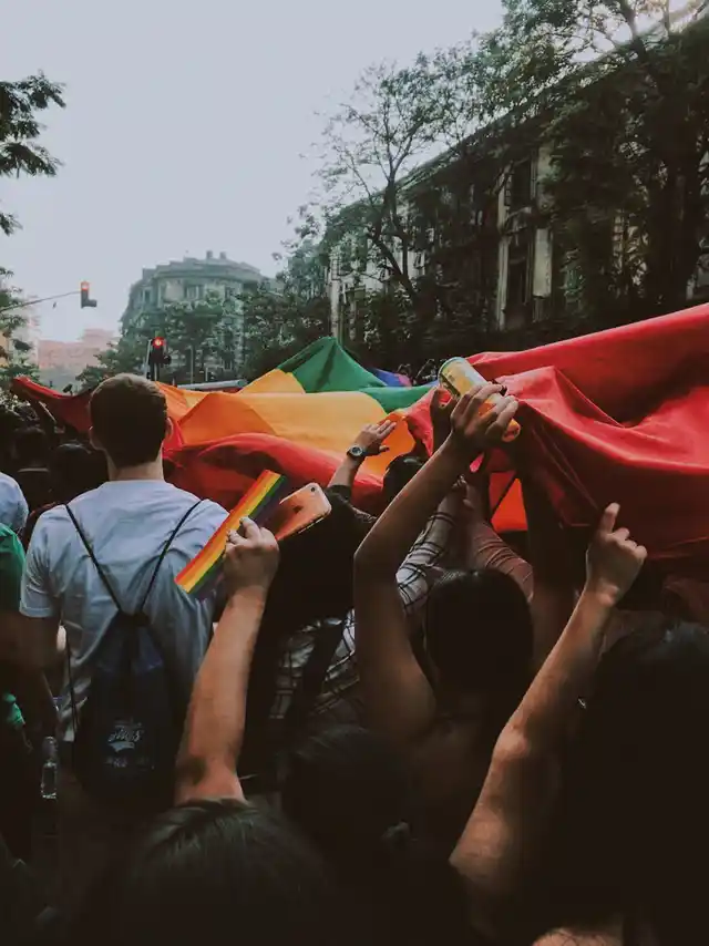 People carry the giant LGBTQI rainbow flag at the Mumbai Pride Parade 2018. 