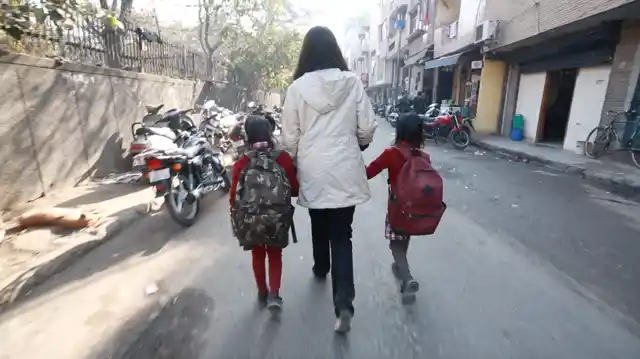 The three of us make an odd pair, running towards the fields like participants in a three-legged race.