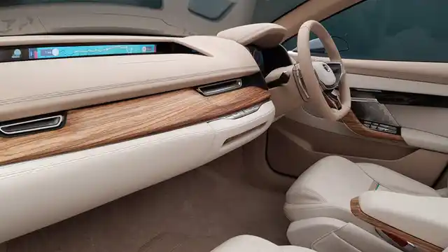 The wood and leather finish looks premium on the interiors. Notice the LCD display for passengers. 