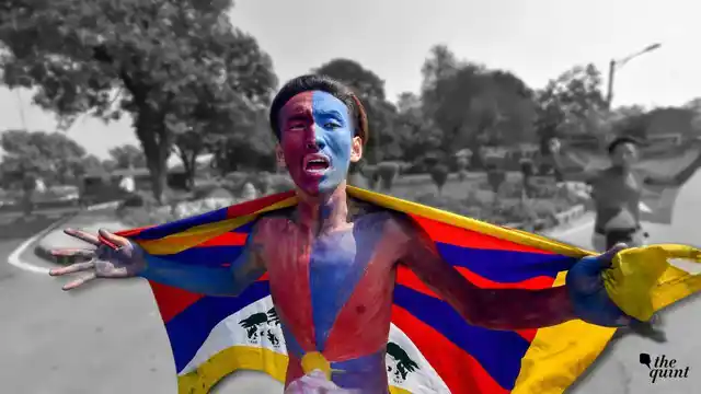 A Tibetan man protesting outside Chinese embassy.
